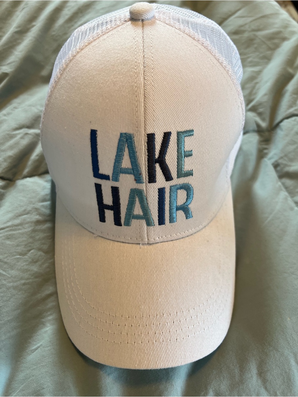 White Trucker Hat with 'LAKE HAIR' Embroidery
